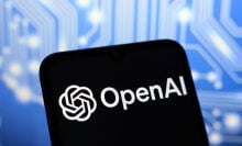 The OpenAI logo appears on the screen of a smartphone