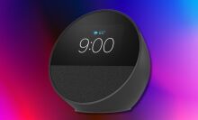 amazon echo spot smart alarm clock on a blue, black, and pink background