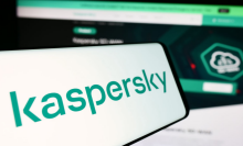 The Kaspersky logo on a mobile phone.