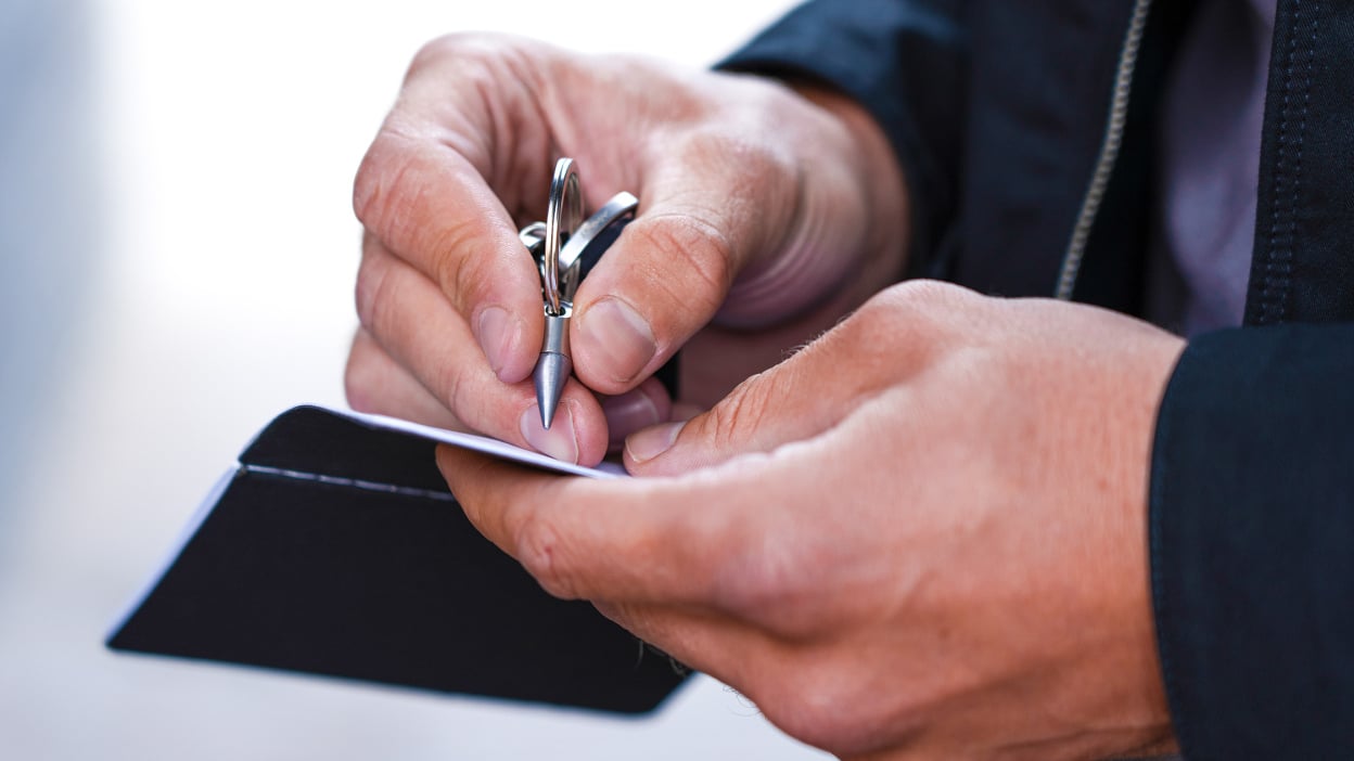 man writing with inkless ForeverPen 