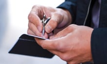 man writing with inkless ForeverPen 