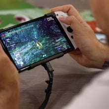 A gamer plays a video game on a Nintendo Switch console, OLED model during Paris Games Week 2022 at Parc des Expositions Porte de Versailles on November 03, 2022 in Paris, France. 