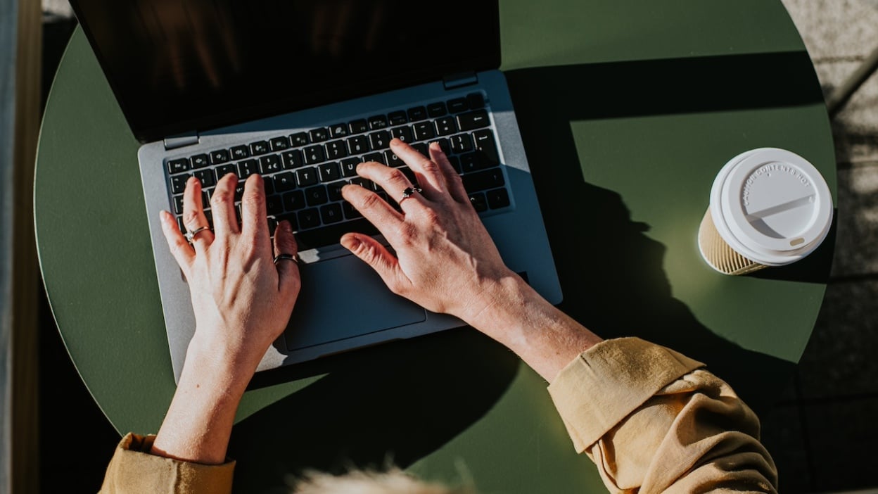 Person typing on laptop