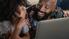 Two people looking at laptop