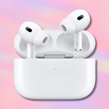 apple airpods pro 2 on a light pink and light purple striped background