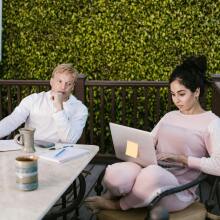 Two people sat with laptops