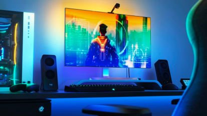 a gaming setup lit up by a Nanoleaf 4D Screen Mirror + Lightstrip Kit on a monitor