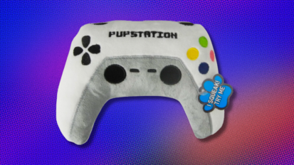 a Posh Paws Plush Pupstation Gaming Controller Dog Toy against a blue, purple, and orange abstract background