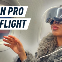 woman wearing the apple vision pro on a plane