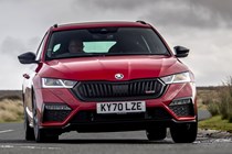 Best estate cars 2024: Skoda Octavia estate, front three quarter cornering, red paint, British road