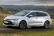 Best estate cars 2024: Toyota Corolla Touring Sports, front three quarter driving, silver paint, British road