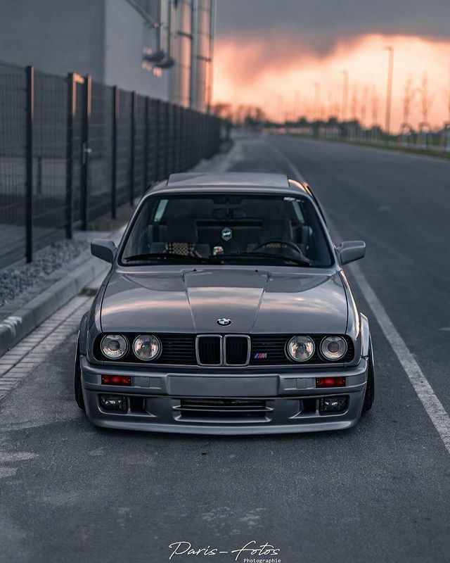 a silver car parked on the side of a road