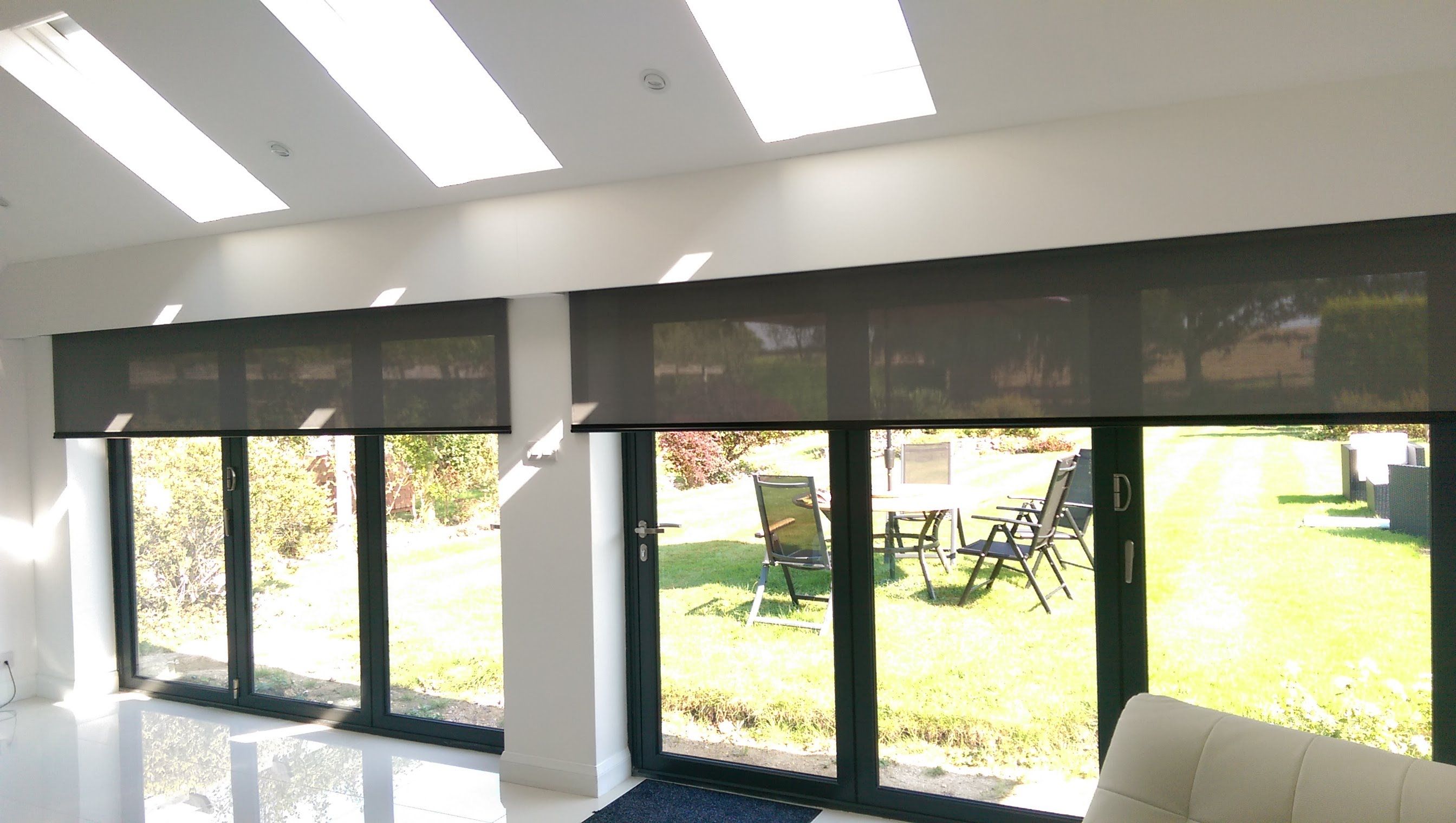 Electric roller blinds for byfold doors hidden behind a pelmet Blinds