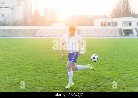 young man performing back kick Stock Photo