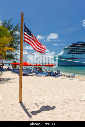 American flag on Grand Turk beach, Bahamas Stock Photo