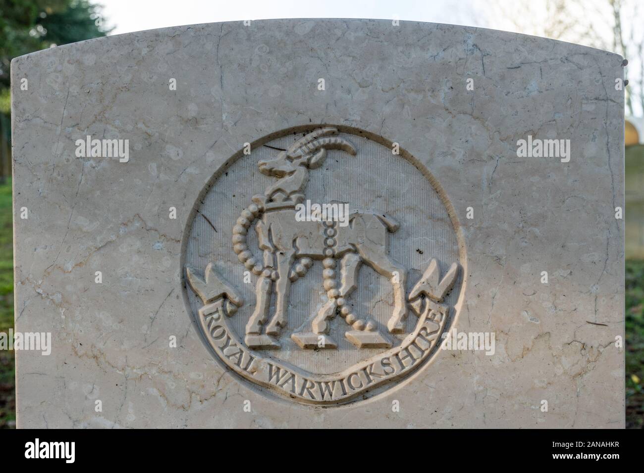 Royal Warwickshire regimental badge emblem crest on a world war one gravestone or headstone, UK Stock Photo