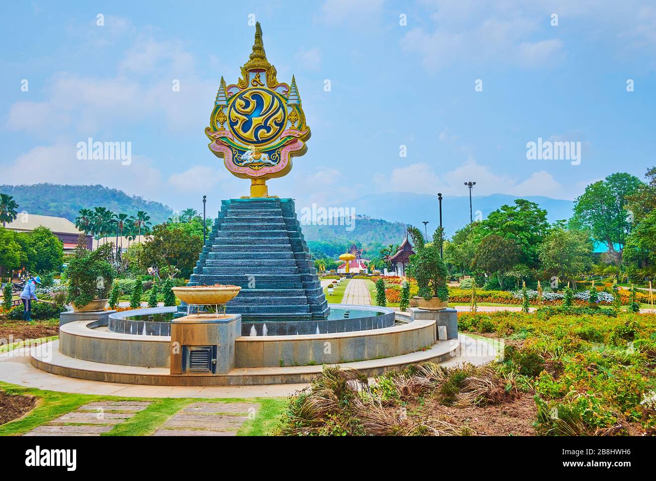 CHIANG MAI, THAILAND - MAY 7, 2019: The fountain with Royal Emblem on the main alley of Rajapruek park, on May 7 in Chiang Mai Stock Photo