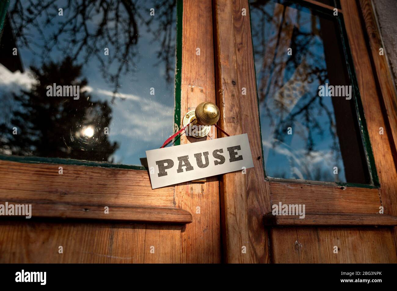 Old Shop-Door with 'Pause' Sign Stock Photo