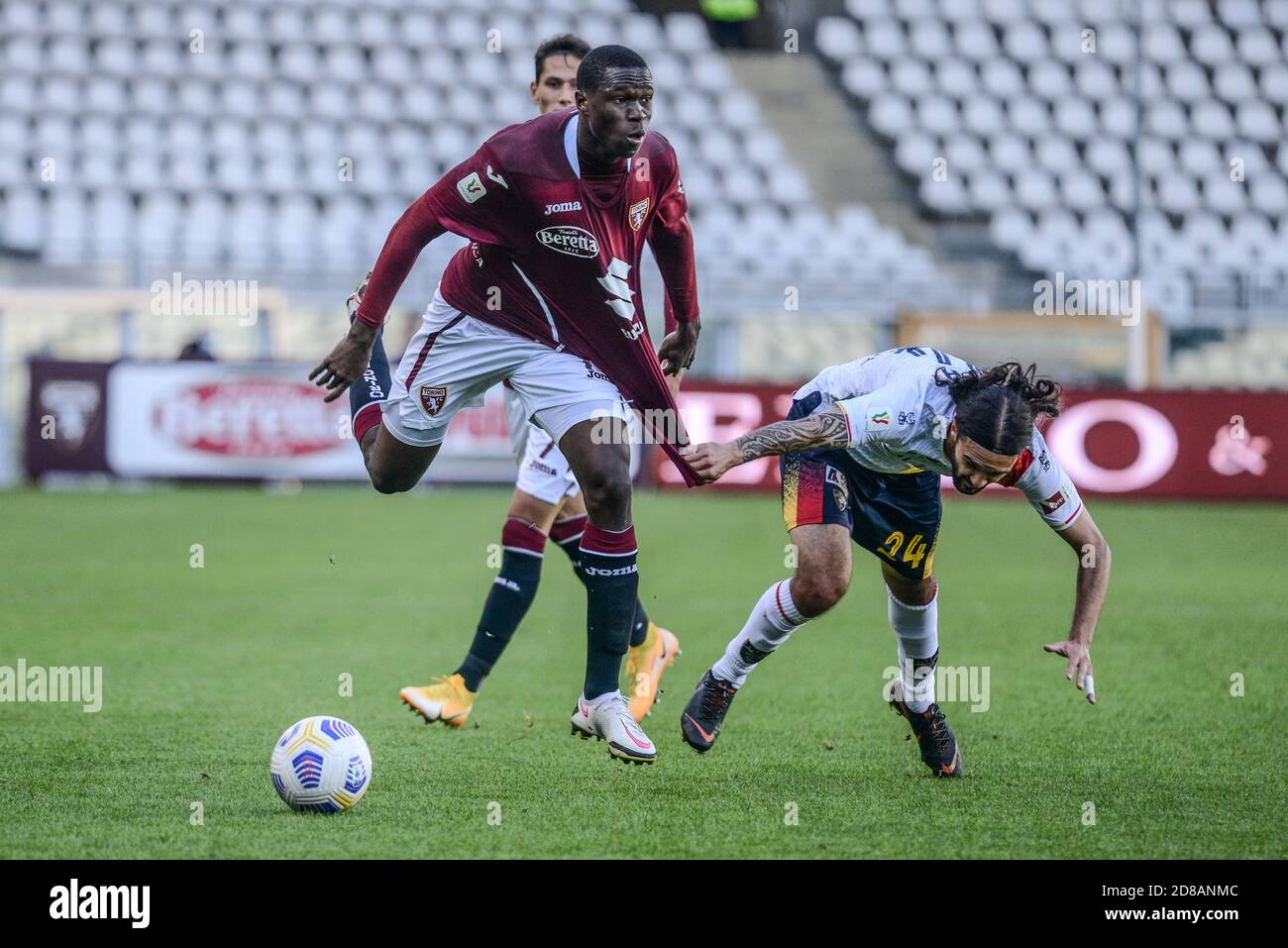 Wilfried Singo of Torino FC and Leonard Zuta of US Lecce during the Coppa Italia football match between Torino FC and US Lecce at Olympic Grande Torin Stock Photo