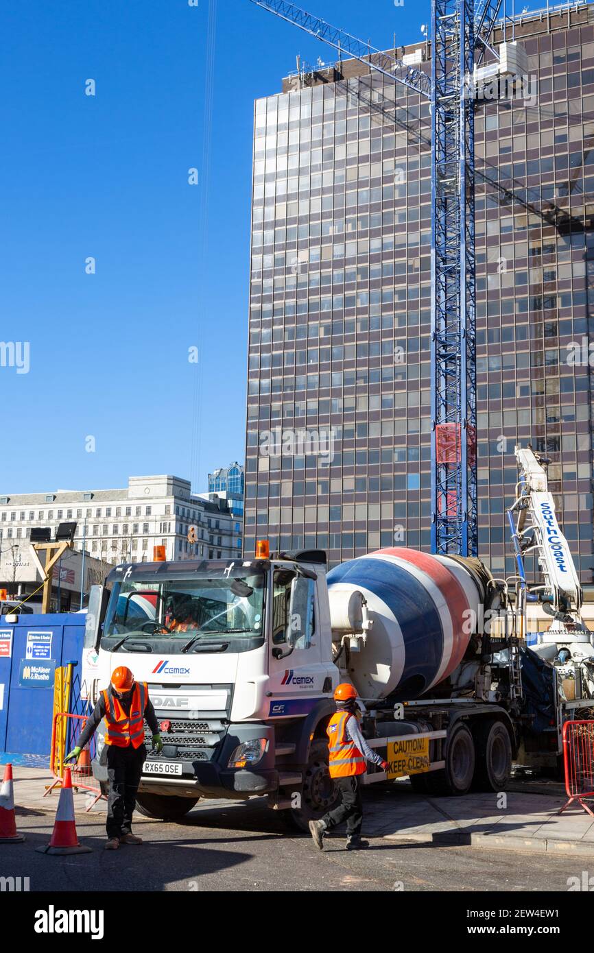 Concrete mixer with boom arm supply, UK Stock Photo