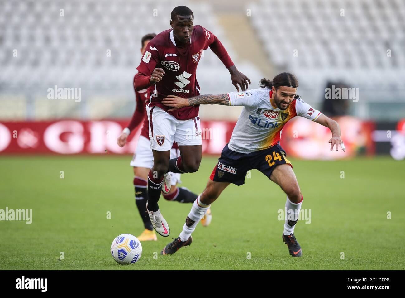 Wilfried Singo of Torino FC clashes with Leonard Zuta of US Lecce during the Coppa Italia match at Stadio Grande Torino, Turin. Picture date: 28th October 2020. Picture credit should read: Jonathan Moscrop/Sportimage via PA Images Stock Photo