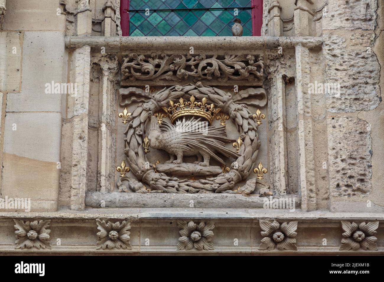 ROUEN, FRANCE - AUGUST 31, 2019: This is an architectural fragment of the facade of an old stone house in the form of the emblem of King Louis 12. Stock Photo