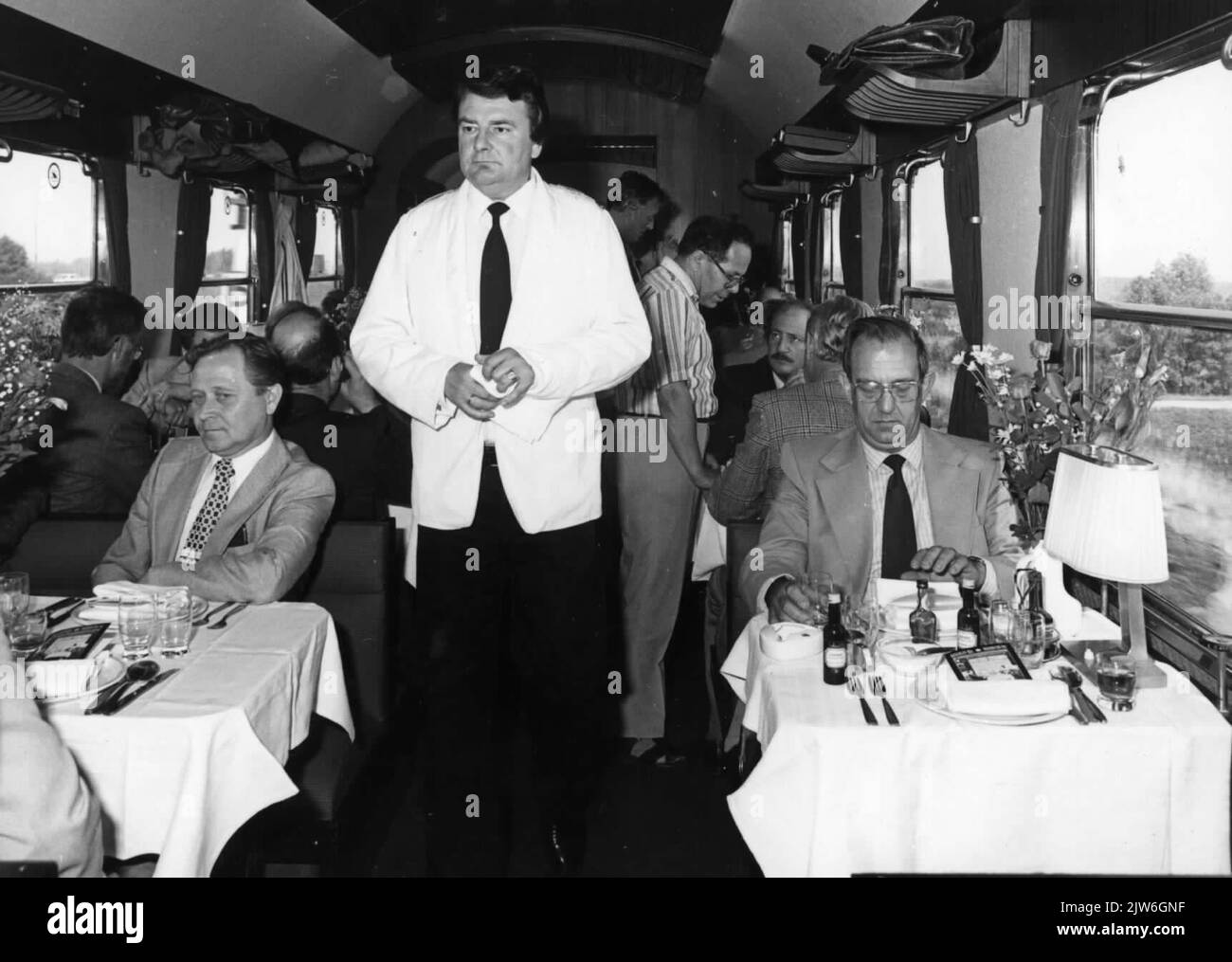 Image of the interior of a restoration vehicle with Leo van de Pol sitting on the right. Stock Photo