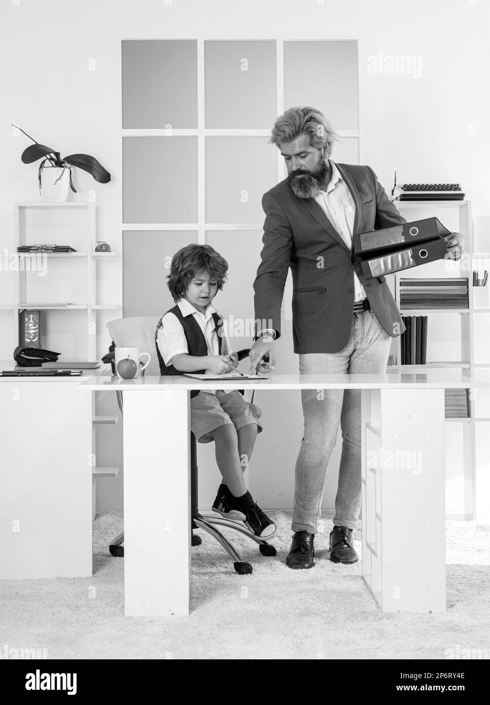 Family business. Father and son in office. Stock Photo