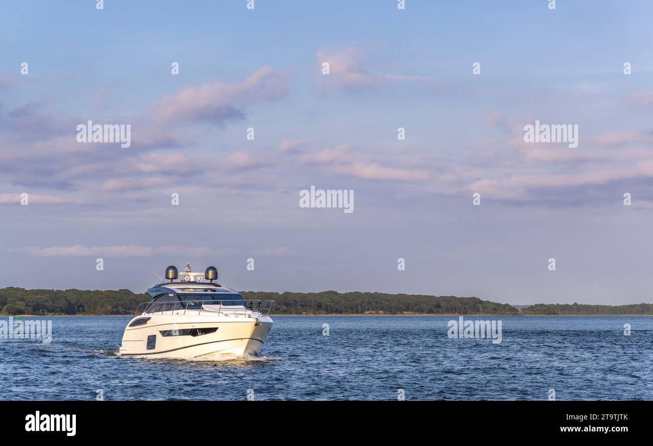 Sleek modern motor yacht underway off shelter island Stock Photo