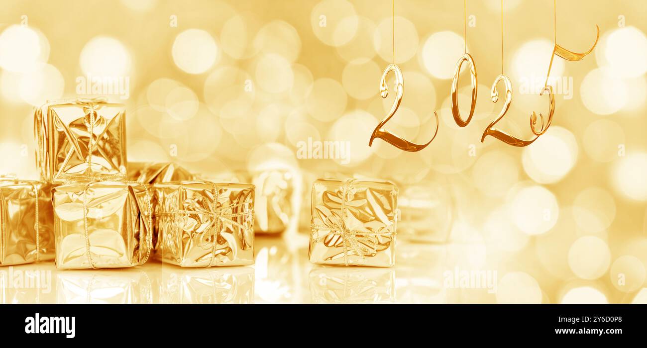 2025, new year card. Small Christmas gifts in shiny golden paper, panoramic web banner Stock Photo