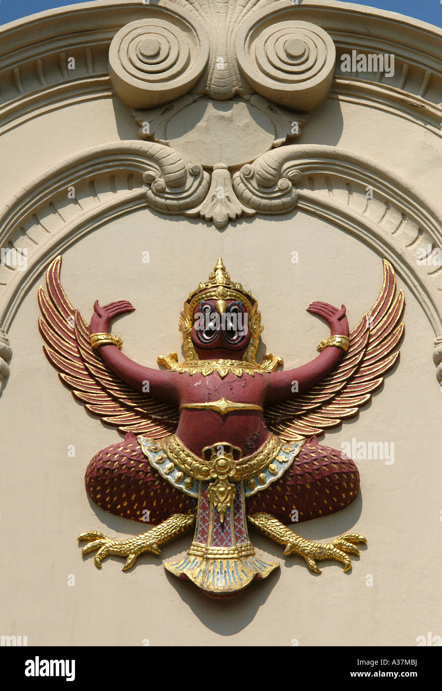 National emblem of Thailand with the Garuda, a mythical half-bird half-human figure. Detail of a facade of the Emerald Buddha Museum in the Royal Pala Stock Photo