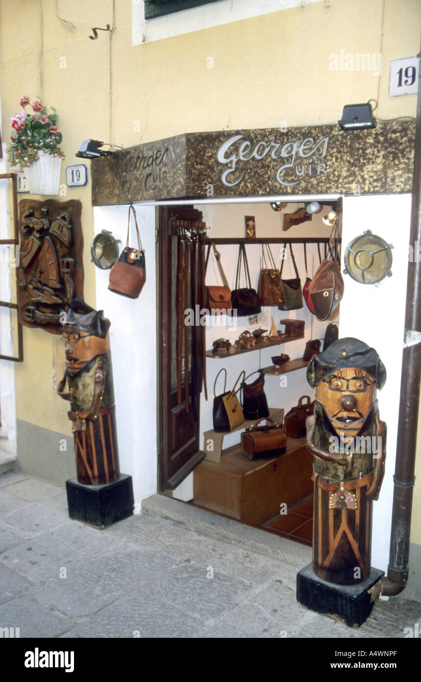 Tourist souvenir shop on the island of Elba with wooden models of Napoleon Bonaparte standing outside Stock Photo