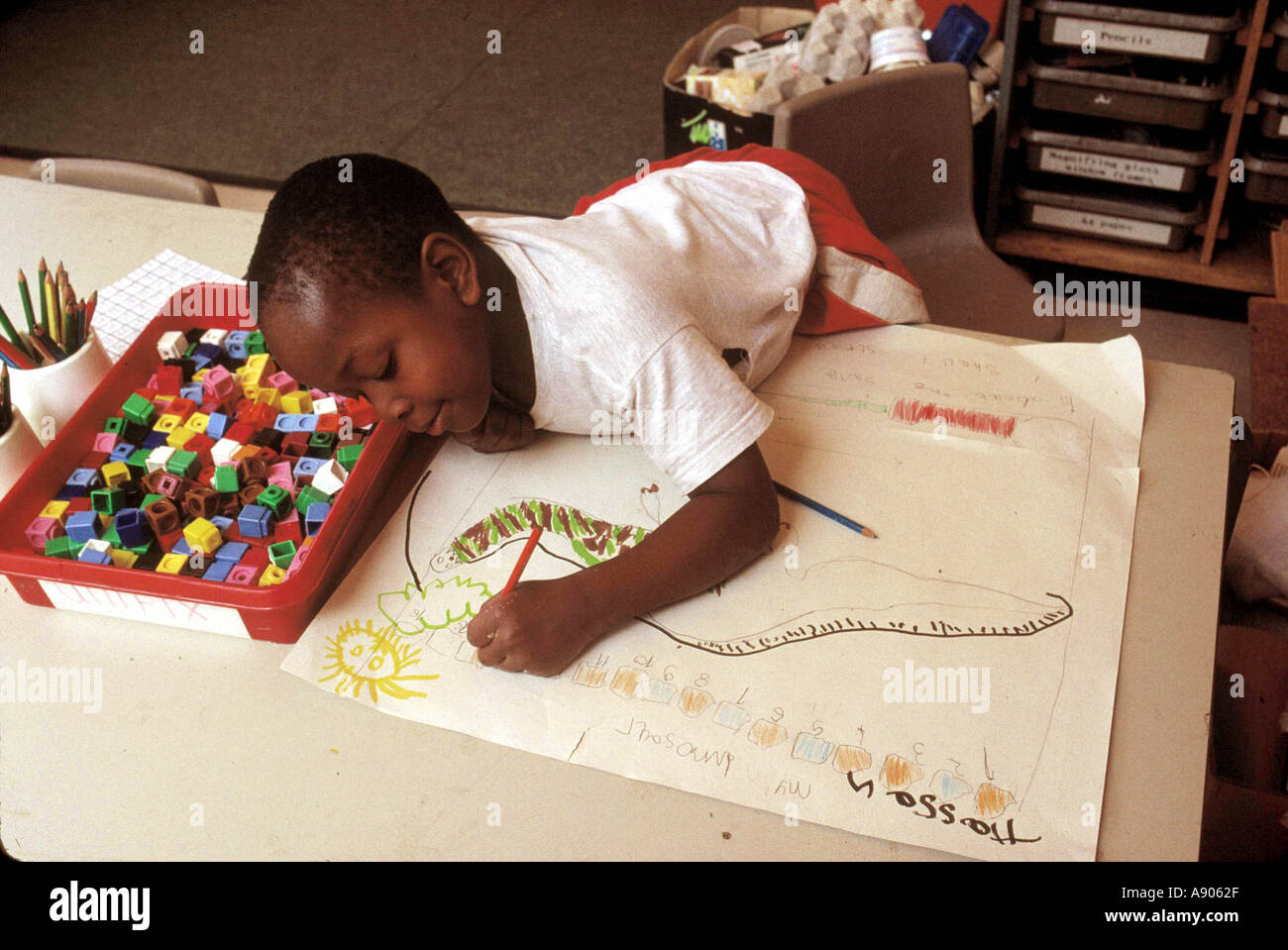 Primary school child drawing a picture Stock Photo