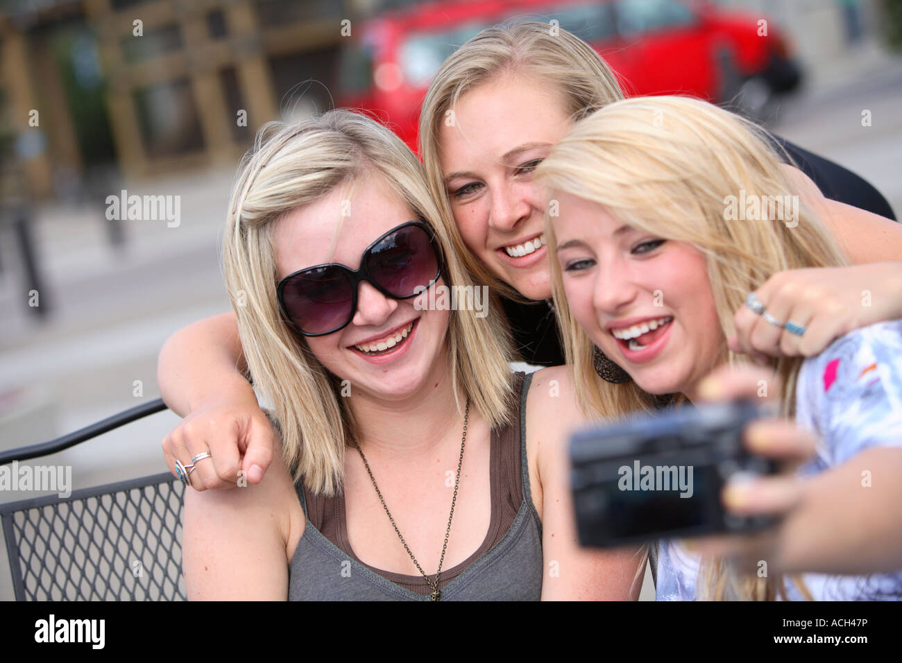 Three girls talking a picture together Stock Photo