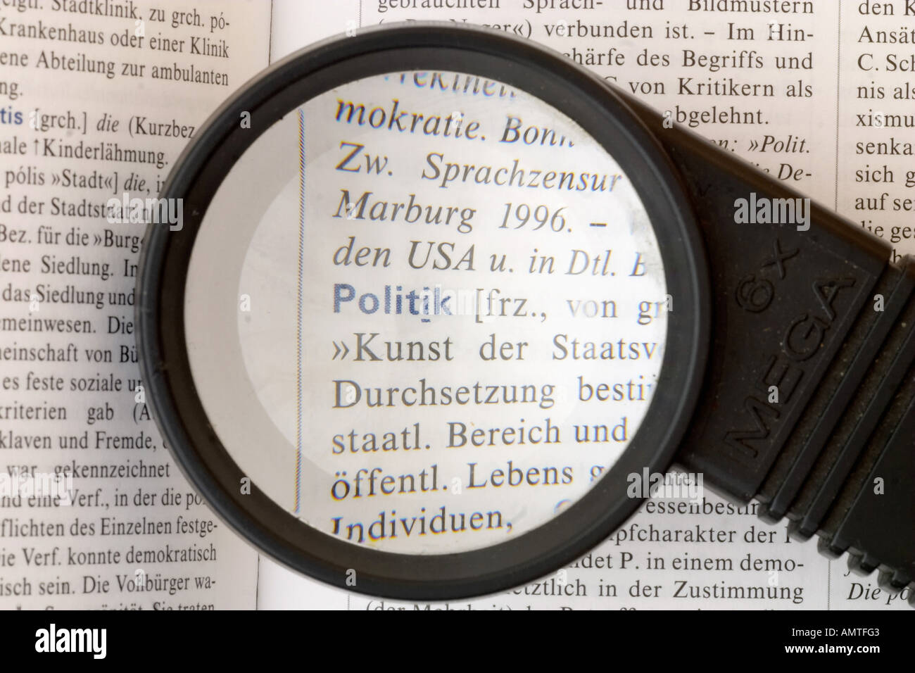 Politics, policy, german word, magnifying glass Stock Photo