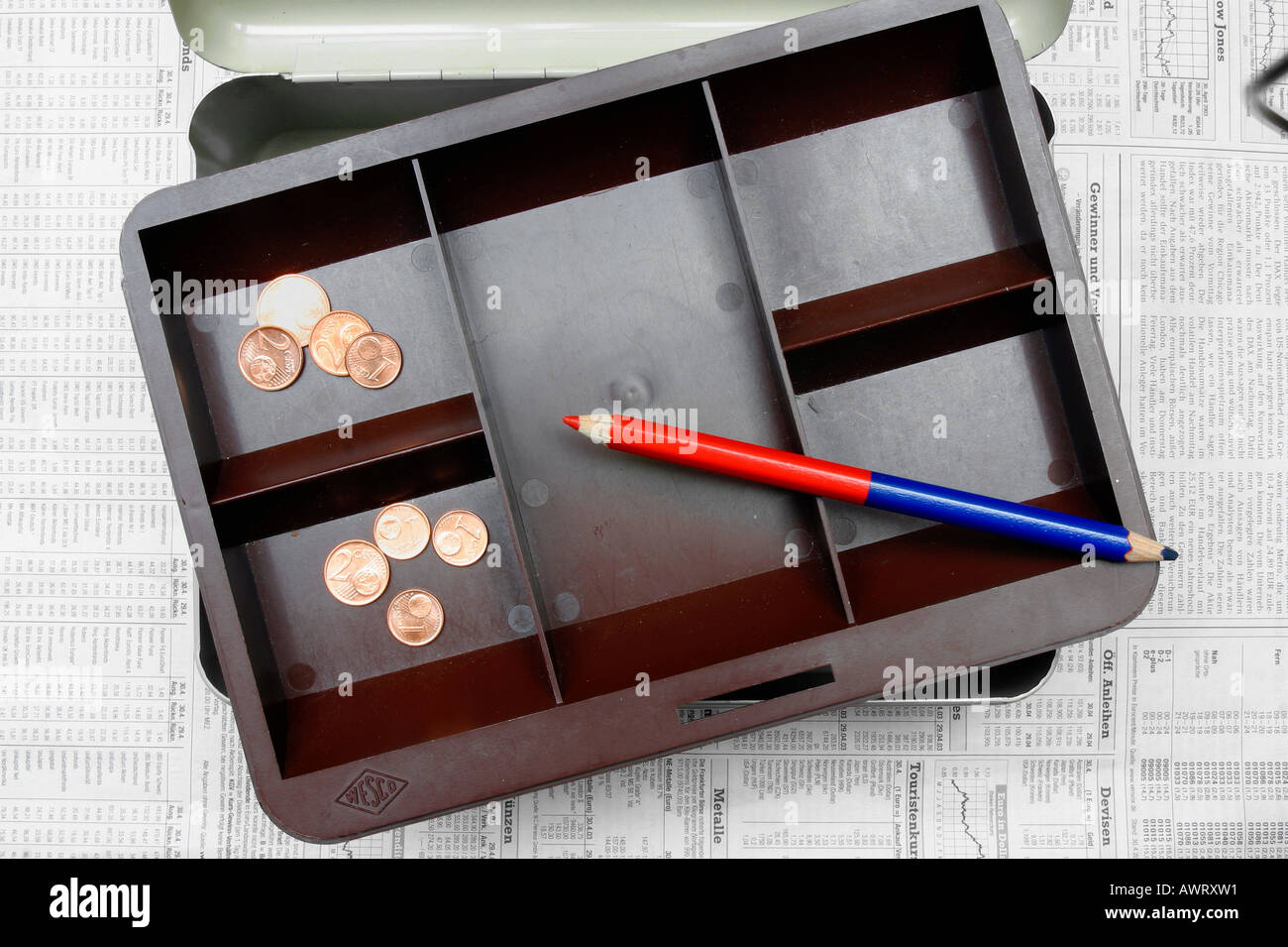 Cash box, empty, cent, coins, red pencil Stock Photo