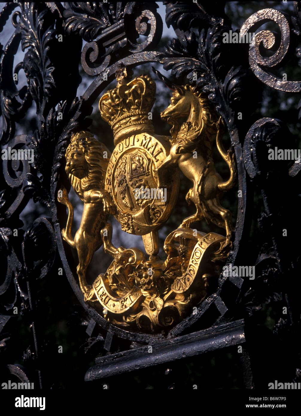 Royal emblem on the gates of one of the royal parks in London England cast in a golden color Stock Photo