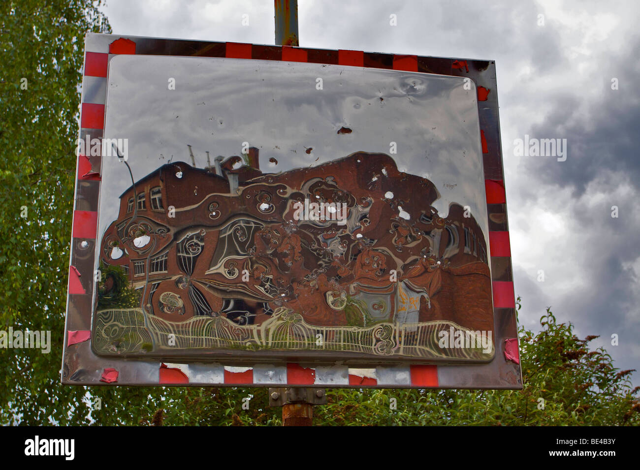 Former factory premises of the former Deutsche Norton Gesellschaft mbH., manufacturer of abrasive material, reflected in batter Stock Photo