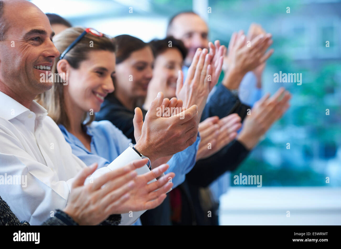 Group of people clapping Stock Photo