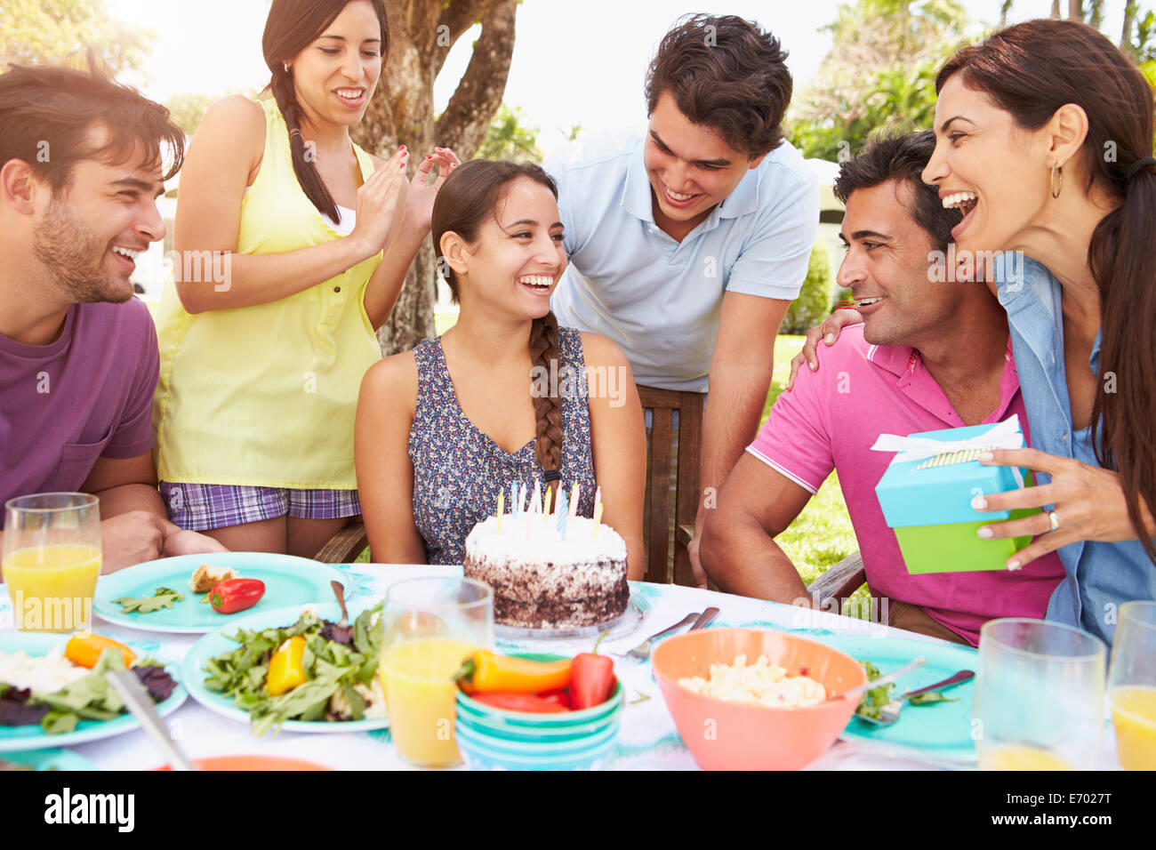 Group Of Friends Celebrating Birthday At Home Stock Photo