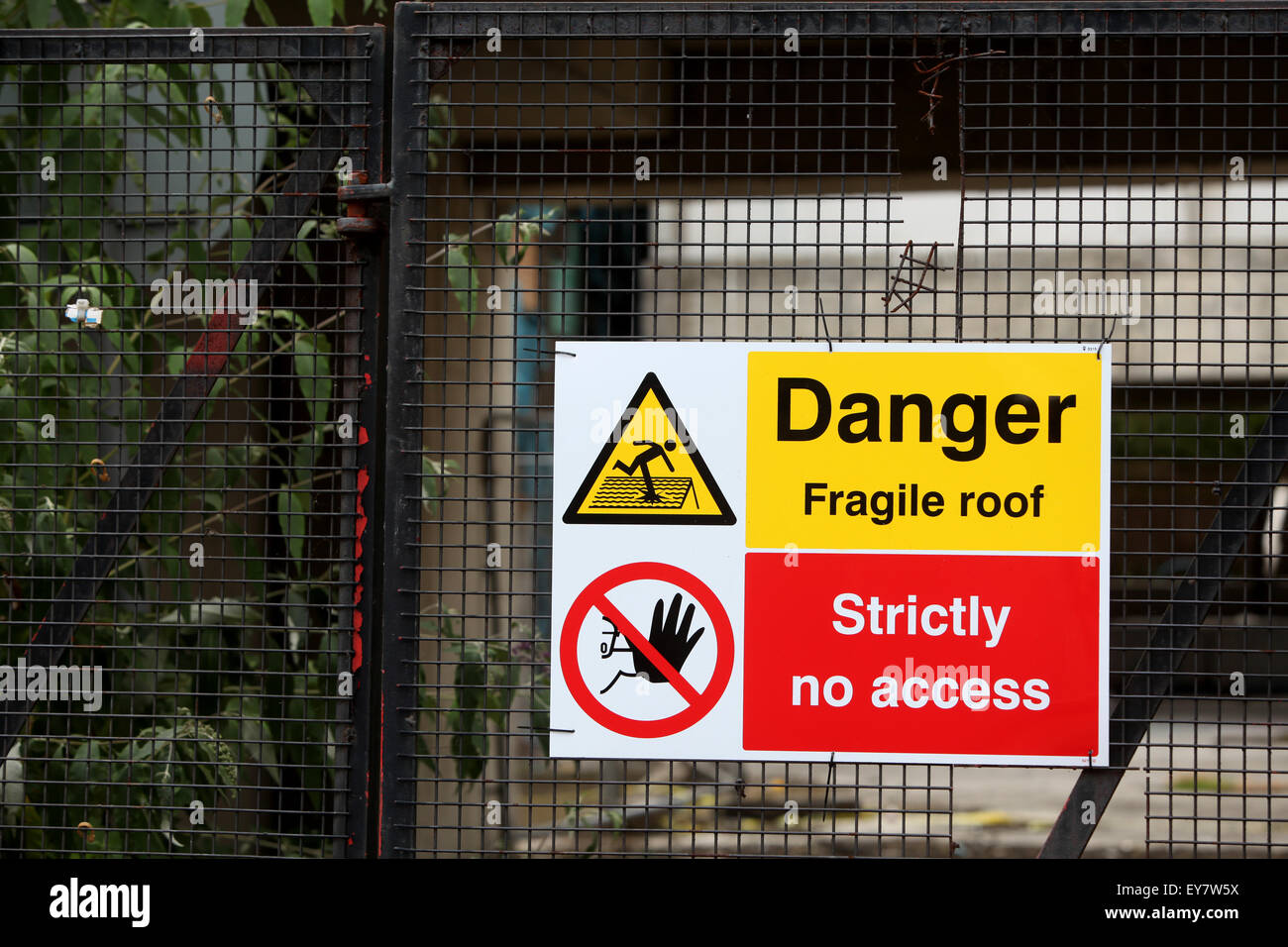 Building site safety signs Danger fragile roof strictly no access Stock Photo