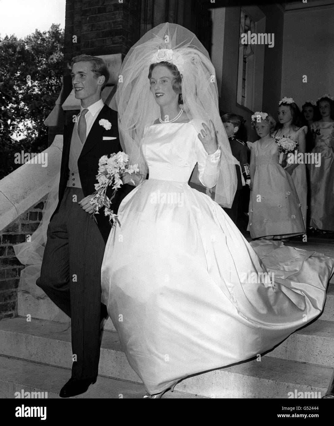 The 22-year-old Earl of Portarlington leaving Holy Trinity Church, Brompton, London, with his 20-year-old bride Davina Windley, after their wedding. Stock Photo