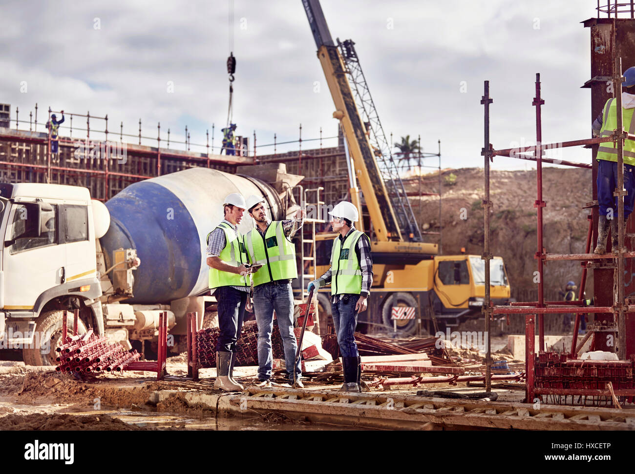 Construction workers working at construction site Stock Photo