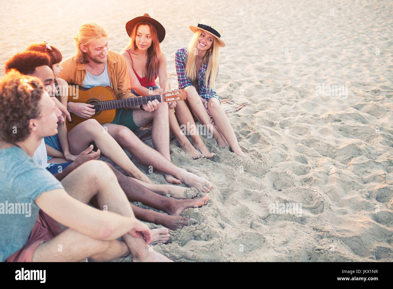 Happy group of friend having party on the beach Stock Photo