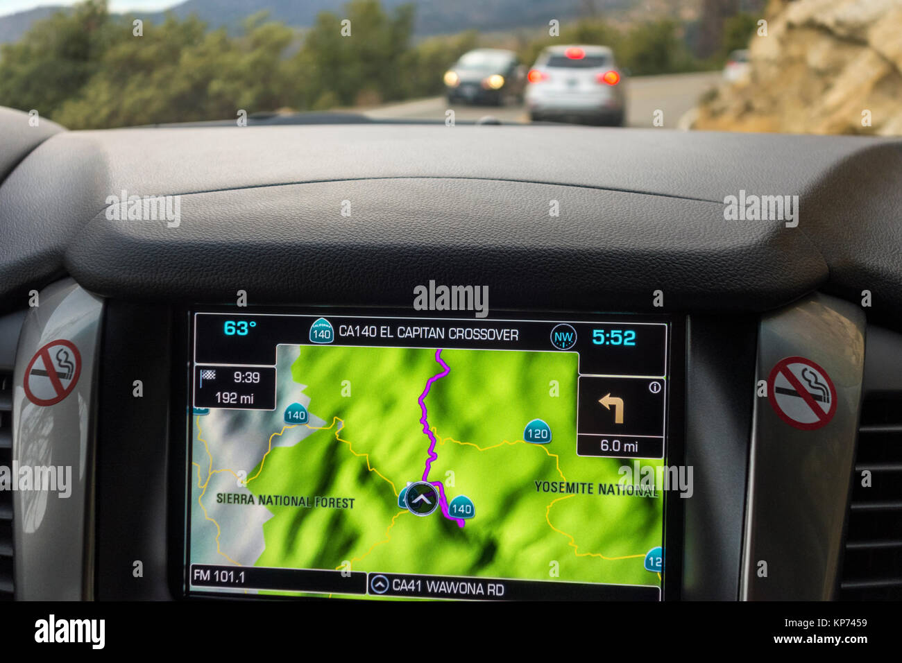 Sat nav, satnav, gps, car navigation integrated in dashboard in American SUV Chevy Tahoe. Driving through Yosemite National Park USA. Stock Photo