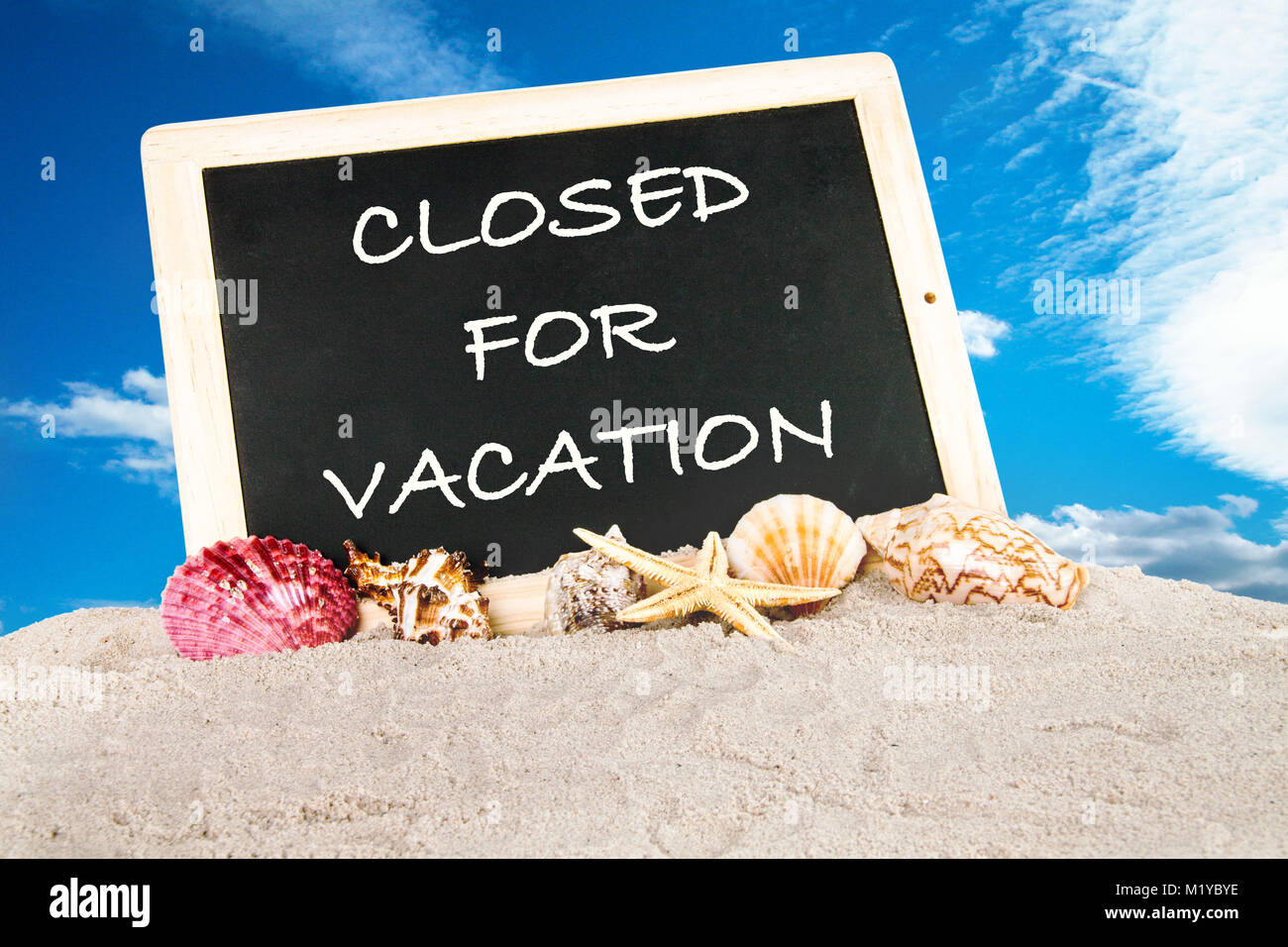 Closed für vacation - Message Borad on beach Stock Photo