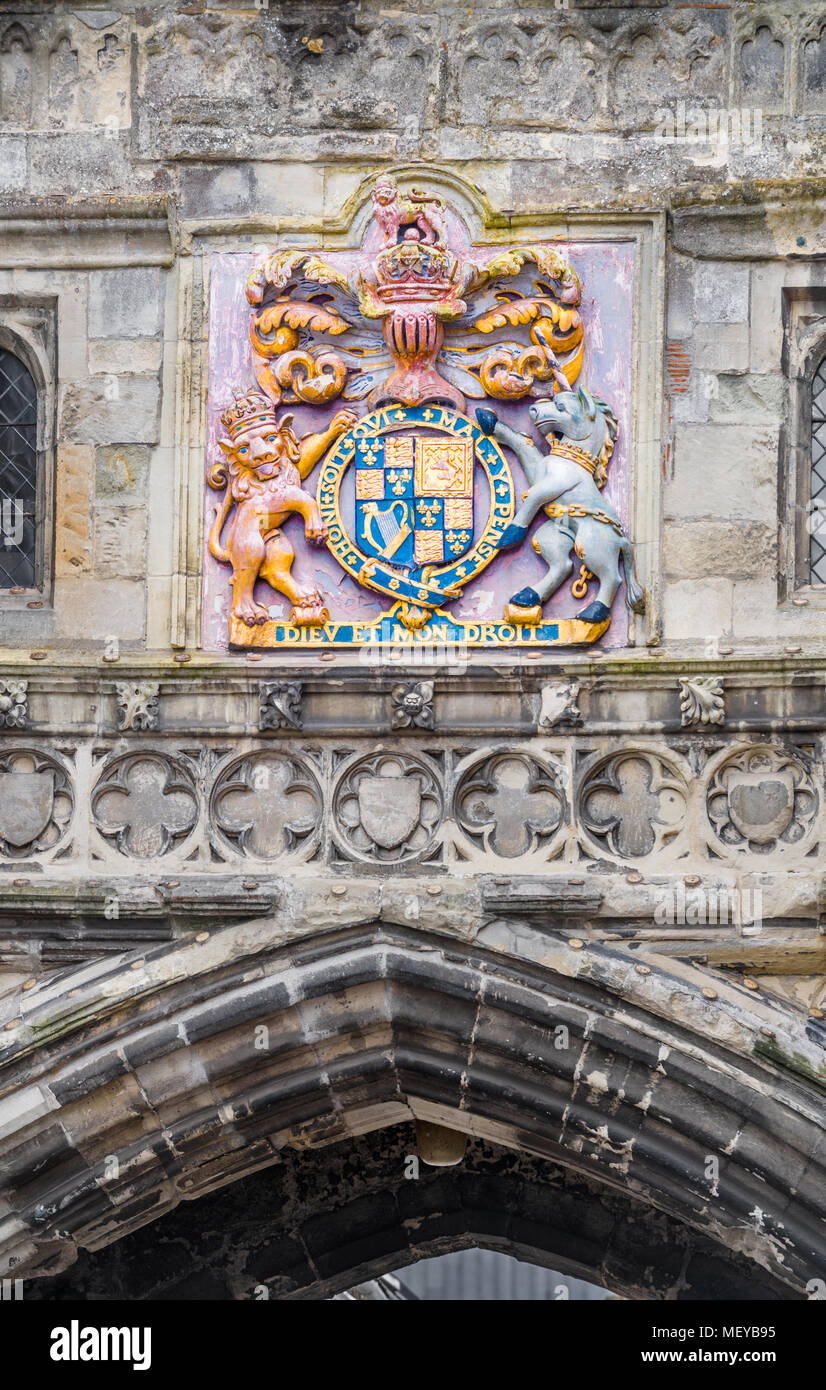 Painted royal emblem on the wall above the high street gateway to the precinct of the medieval cathedral at Salisbury, England. Stock Photo