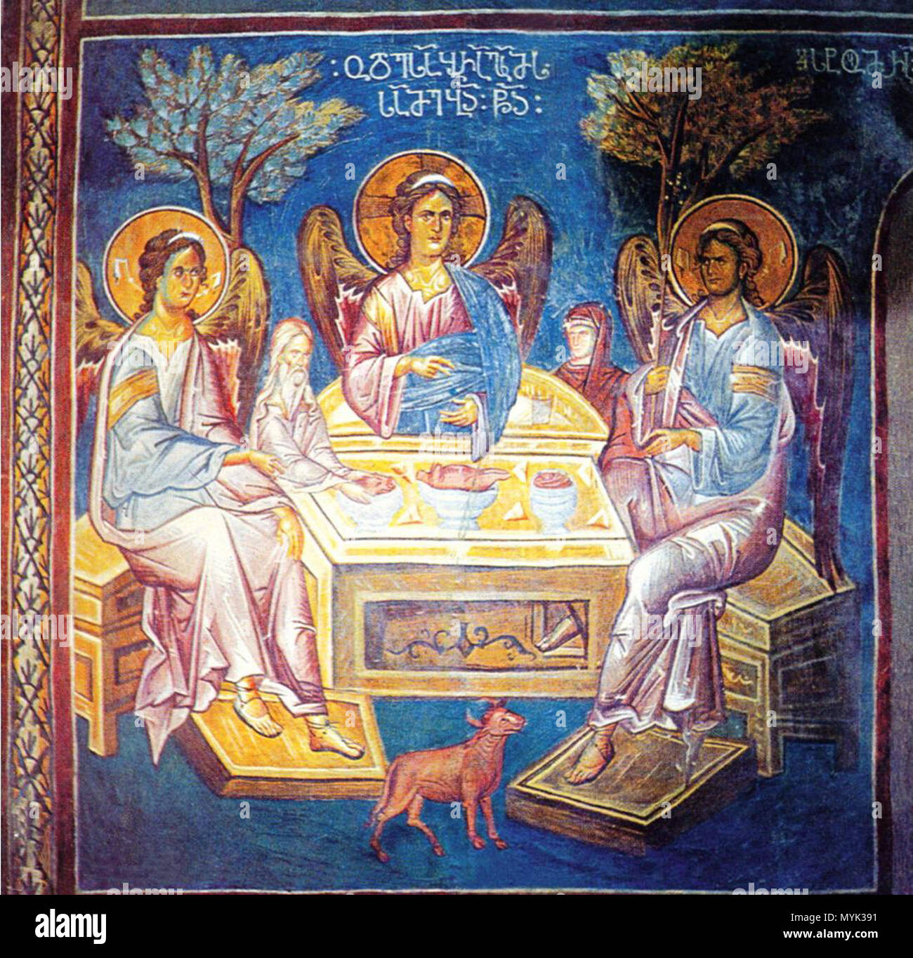 . English: A fresco depicting of the Holy Trinity with a Georgian inscription (asomtavruli) from the Lykhny cathedral: „ოდეს აბრაამს ესტუმრა სამებაი წმიდაი.“. 14th century. Unknown 334 Lykhny fresco Stock Photo