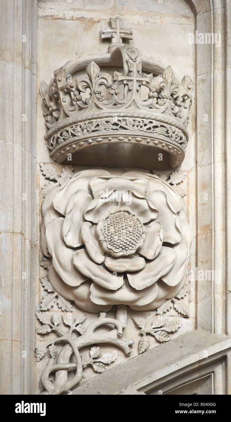 Carved stone royal emblem on the wall of the ante-chapel in the tudor medieval chapel of King's college, university of Cambridge, England. Stock Photo