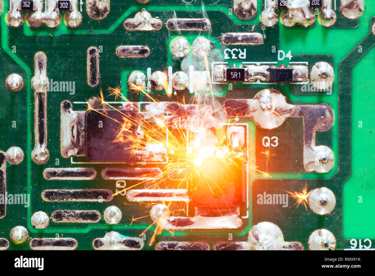 Electricity circuit short burn out overheat chip on the PCB. Stock Photo